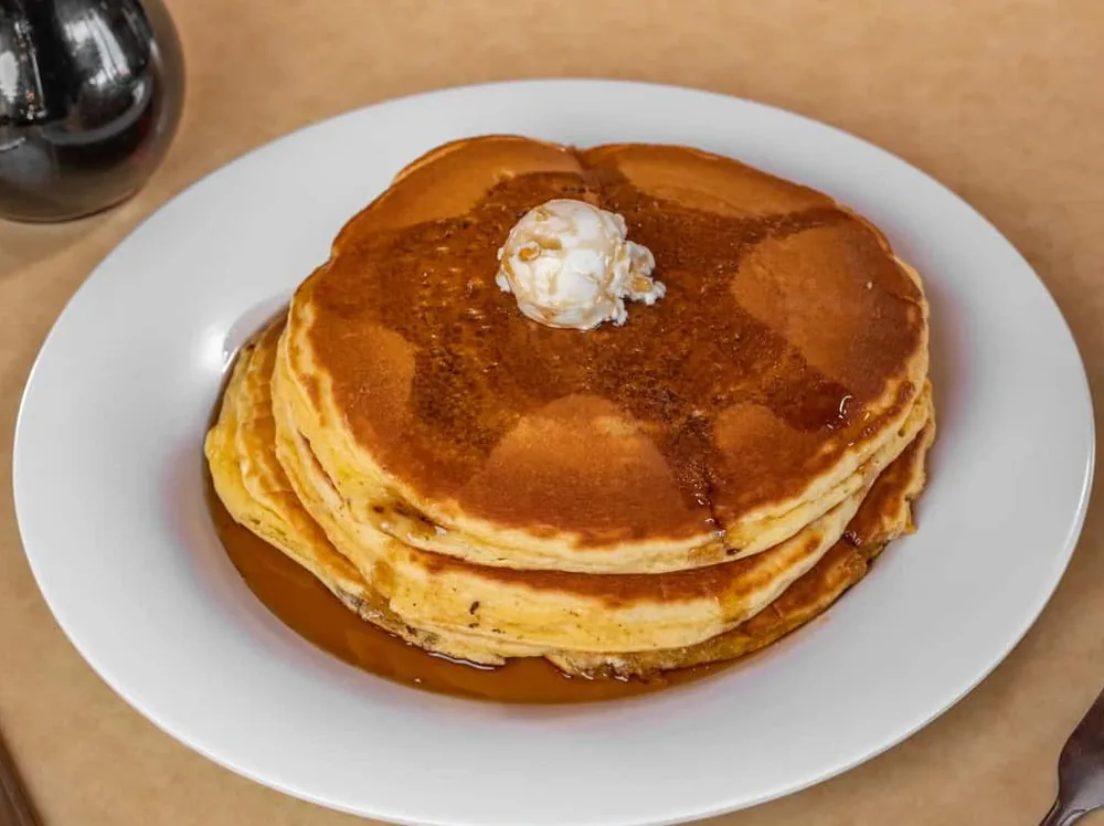 Full stack of pancakes at Omega Burgers